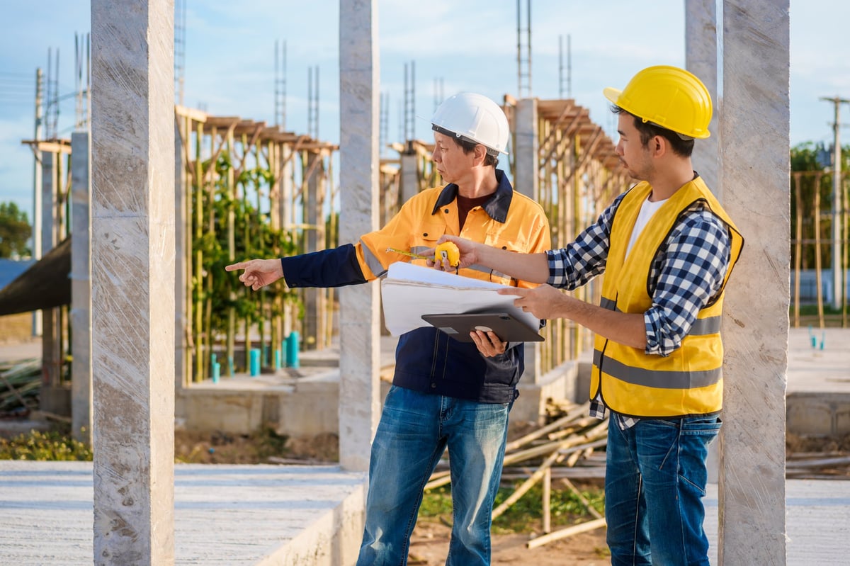 Contractor and homeowner reviewing plans
